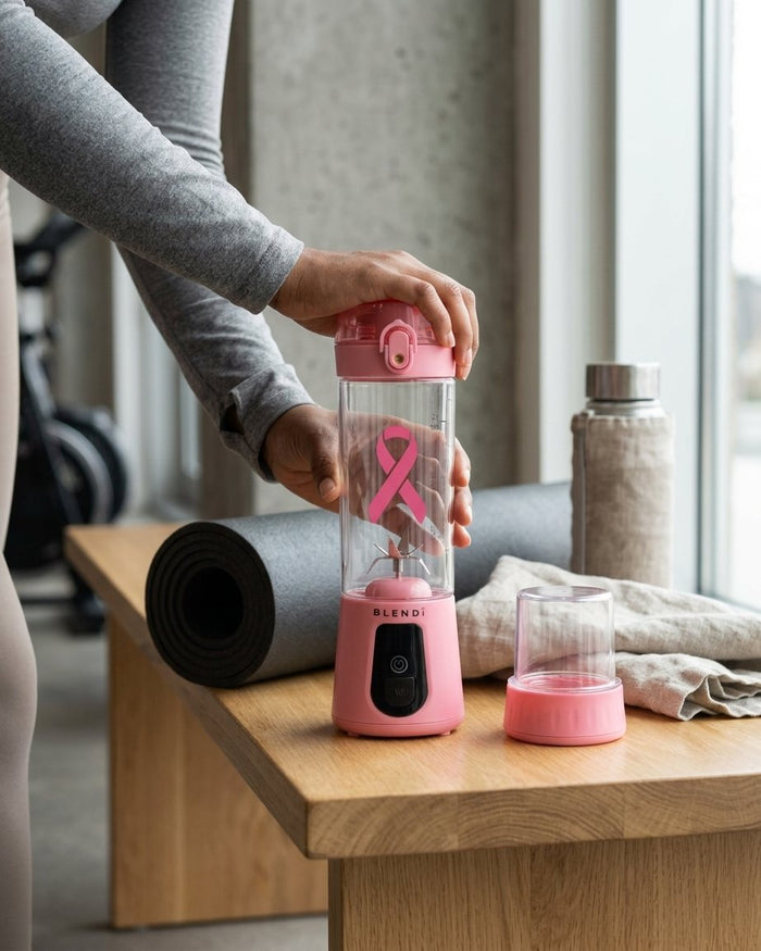 Blush BLENDi Pro+ on a wooden bench next to a yoga mat
